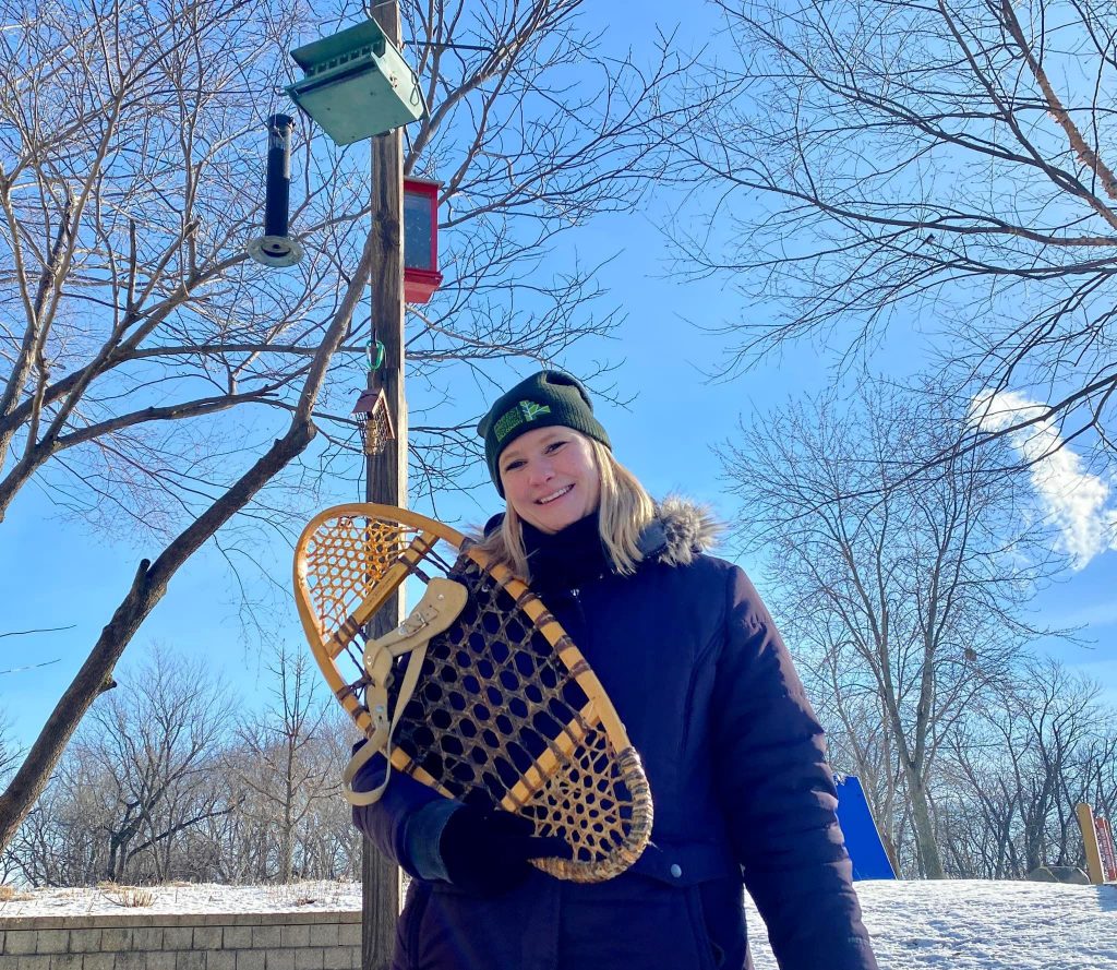 Suzy Lyttle, program host of the Forest Preserve District of Will County’s monthly nature show, “The Buzz,” includes some snowshoeing tips in January’s episode, which airs January 26 on Facebook and YouTube. –Forest Preserve photo | Chad Merda