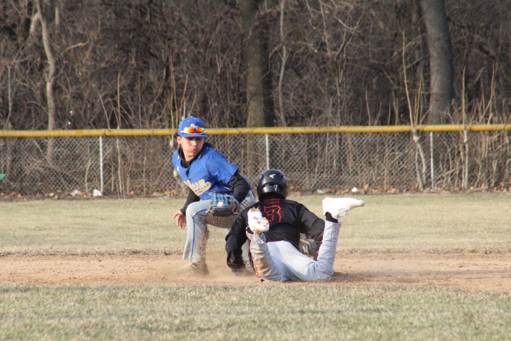 Duane Doss, #3, slides into base on a close-one.
-Photo by Jim Piacentini.