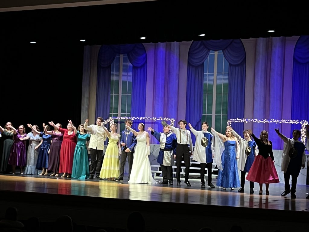 The cast takes a bow after a successful performance.