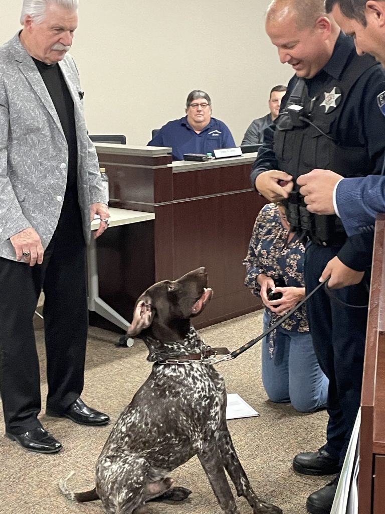 Apollo takes the oath of office from Clerk Lewis, with State’s Attorney Glasgow, Handler Gulli and Mayor Adriensen looking on. –Photo submitted.