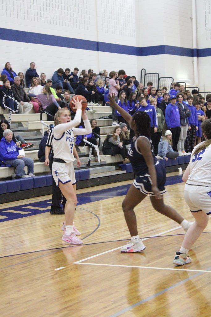 Blue Devil senior Mady Kibelkis (#12) finished with 16 points to help the Devils trounce Lisle on January 30. –Photo by Jim Piacentini.