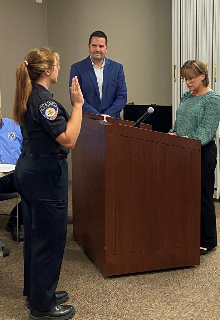 Officer Rebecca Buhs takes the Oath of Office and becomes a full-time officer for the Village of Manhattan. –Photo submitted.