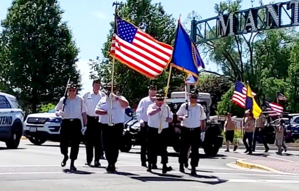 Manteno American legion Color Guard marching down Main Street in Manteno to Legion Park. Photo by Dan Gerber.