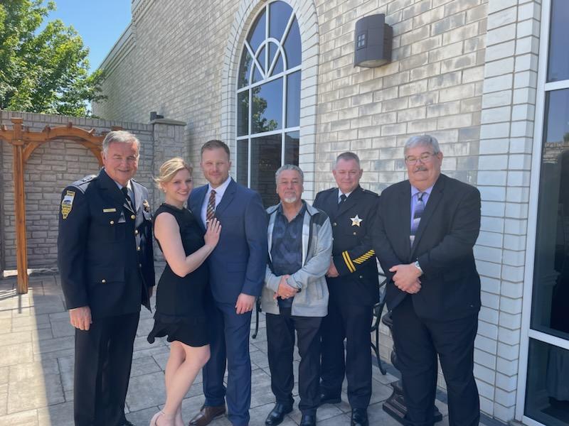 Pictured at the recent event were, left to right: Police Chief Terry Lemming, Kristen Dacorte, Sgt. Aaron Dacorte, Village Trustee Roger Stacey, Lt. Rick Emerson, and Village Administrator Robert Barber. –Photo submitted.