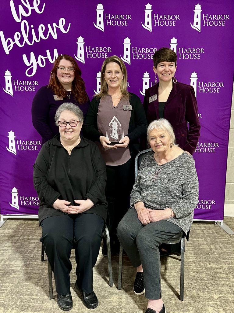 Harbor House founders Patricia Sander and Beverly Seaton-Johnson presented the Light the Way Award to Brook Coutant. Pictured, left to right, are: Seated - Patricia Sander and Beverly Seaton-Johnson; standing - Harbor House Community Advocacy Supervisor Jayden, Brook Coutant, Harbor House CEO and Executive Director Jenny Schoenwetter. –Photo submitted.