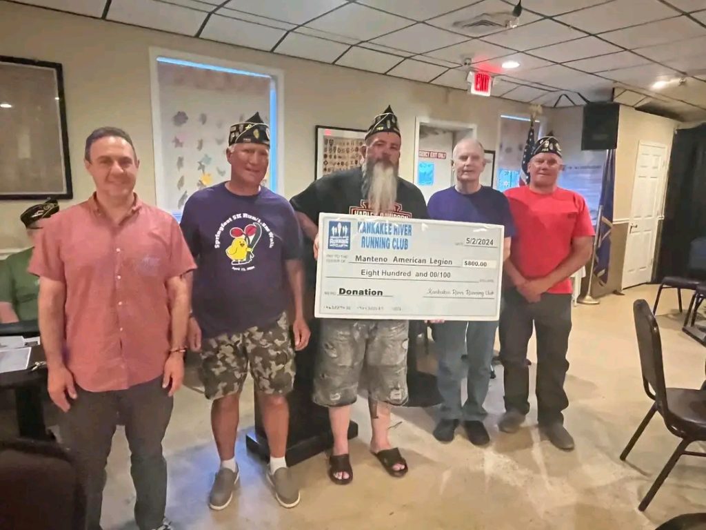 The KRRC presented the Manteno American Legion with an $800 check from profits obtained at the Springfest 5K Run/Walk. Pictured, left to right, are: Alan Toronjo, Dan Gerber, Legion Commander Sean McNamara, Dave Bolke, and Mark DuFrain. –Photo by Amelia Toronjo.