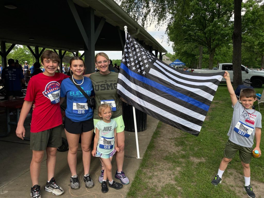 Flags supporting the men in blue were abundant at the I Got Your Six, with some running the entire distance carrying the flag. –Photo courtesy of Dan Gerber.