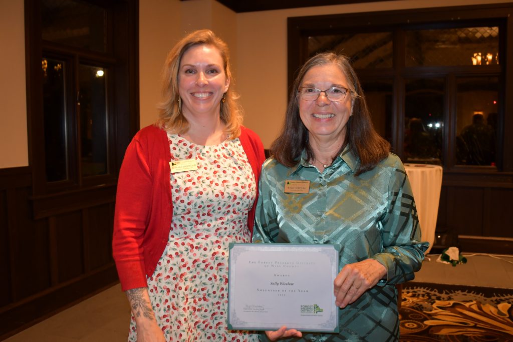 Volunteer of the Year Sally Wieclaw (right), takes time for a quick photo with Barbara Sherwood, the Forest Preserve’s restoration ecologist. –Photo by Forest Preserve staff, Glenn P. Knoblock.